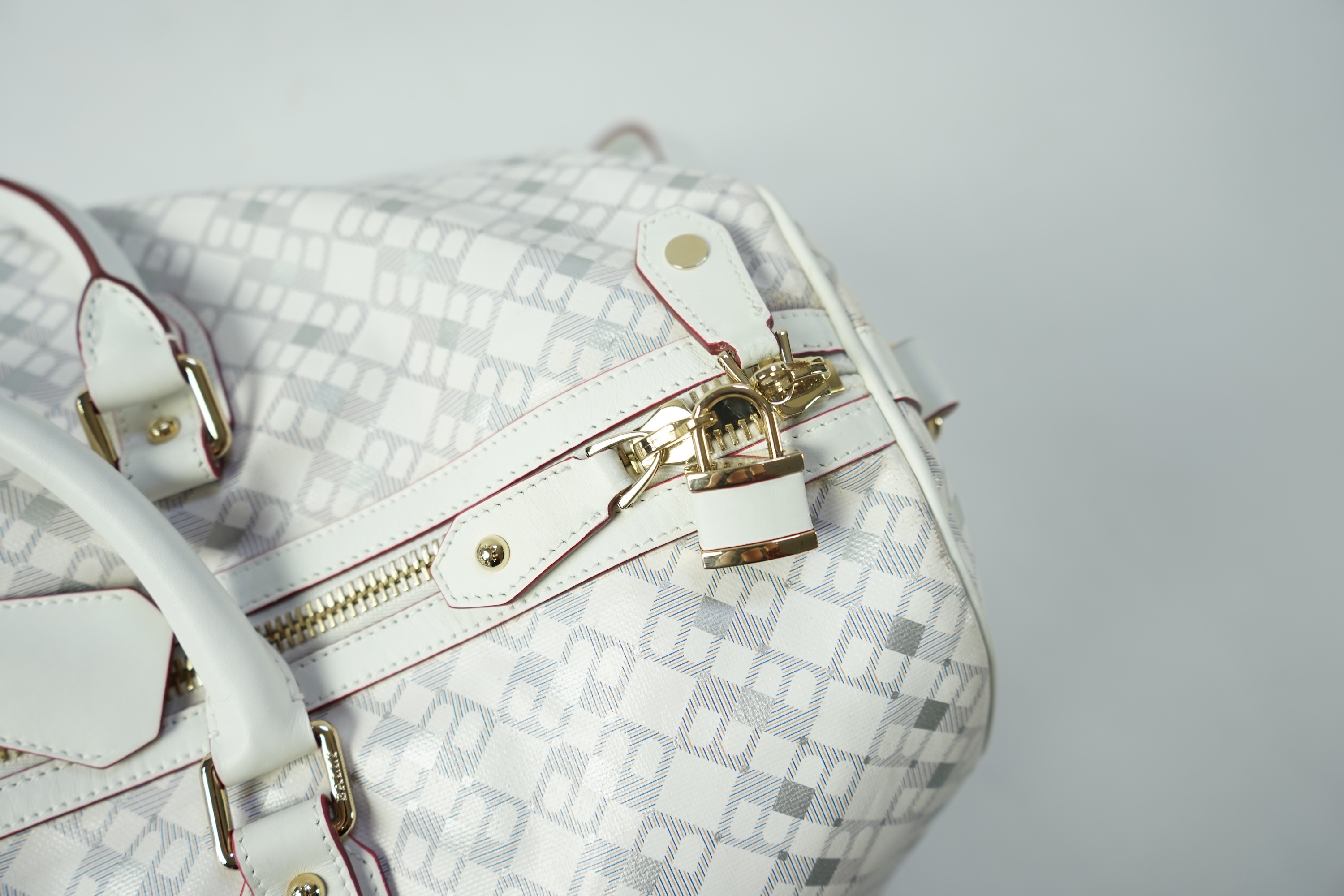 A large white monogram Bally weekend bag 'Berlinda' with red tiger detail